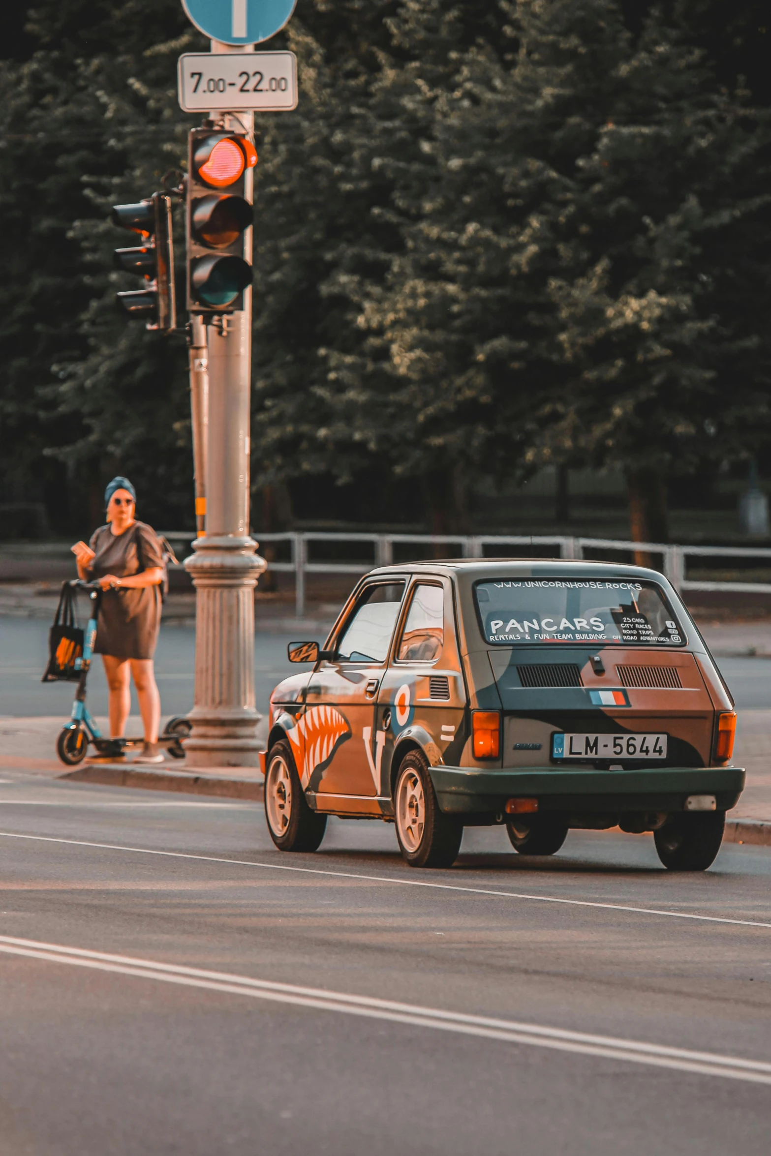 an older car is shown sitting on the street