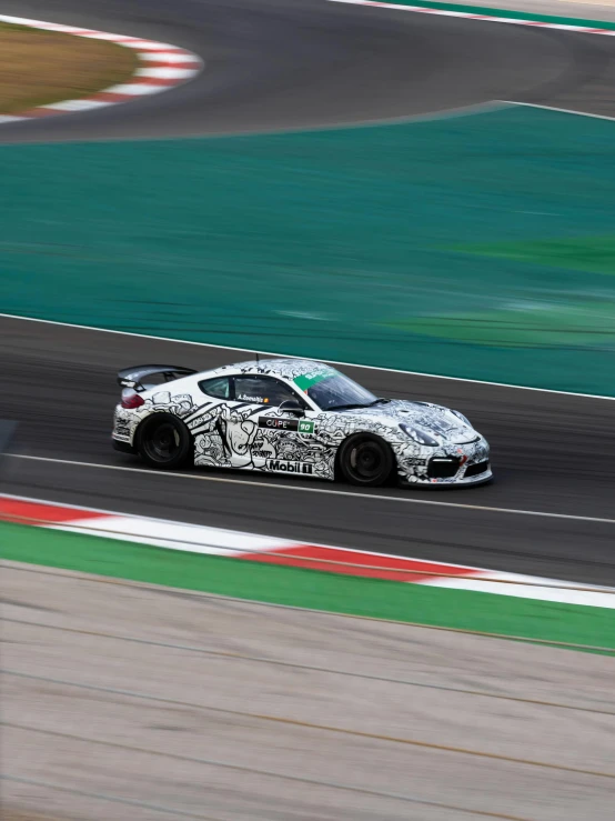 an exotic racing car going around a track