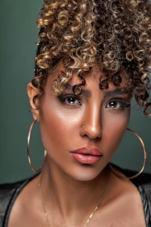 a close up of a woman with curly hair, an album cover, inspired by Araceli Gilbert, trending on pexels, tanned beauty portrait, curly pixie hair, dramatic highlights, high lights