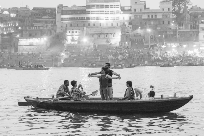 a black and white photo of people in a boat, by Jitish Kallat, pexels contest winner, surrounding the city, making of, facebook post, lecherous pose