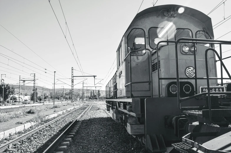 a black and white photo of a train on the tracks, unsplash, detailed medium format photo, illustration, side - view, vehicle