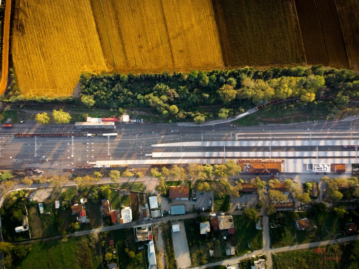 an aerial view of two roads and trees