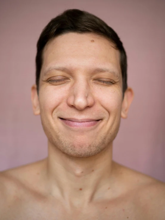 a man looking at his self while smiling