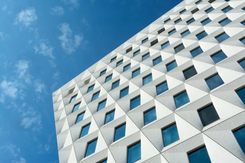 a tall white building with lots of windows, unsplash contest winner, modernism, bjarke ingels, clear blue skies, uhq, square