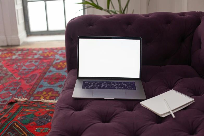 a laptop computer sitting on top of a purple couch, pexels, persian design, rectangle, no - text no - logo, medium-shot