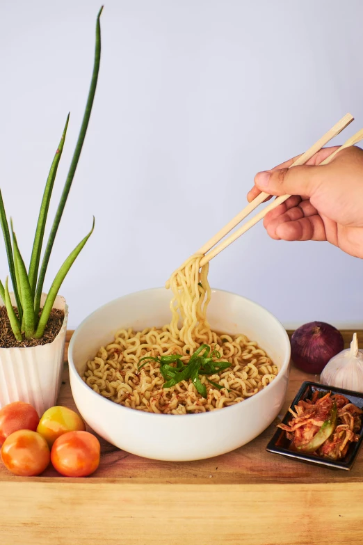 a person holding chopsticks over a bowl of noodles, dau-al-set, botanicals, square, unbeatable quality, arc