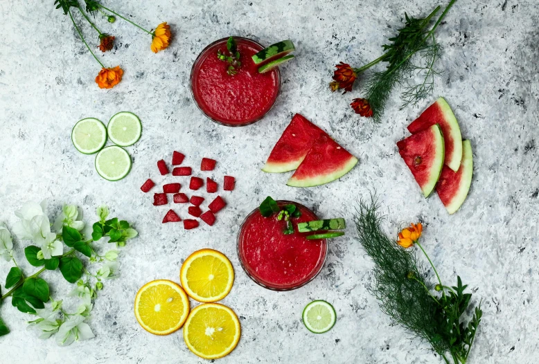 a table topped with slices of watermelon and slices of lime, by Julia Pishtar, pexels contest winner, renaissance, beets, slush, botanicals, background image