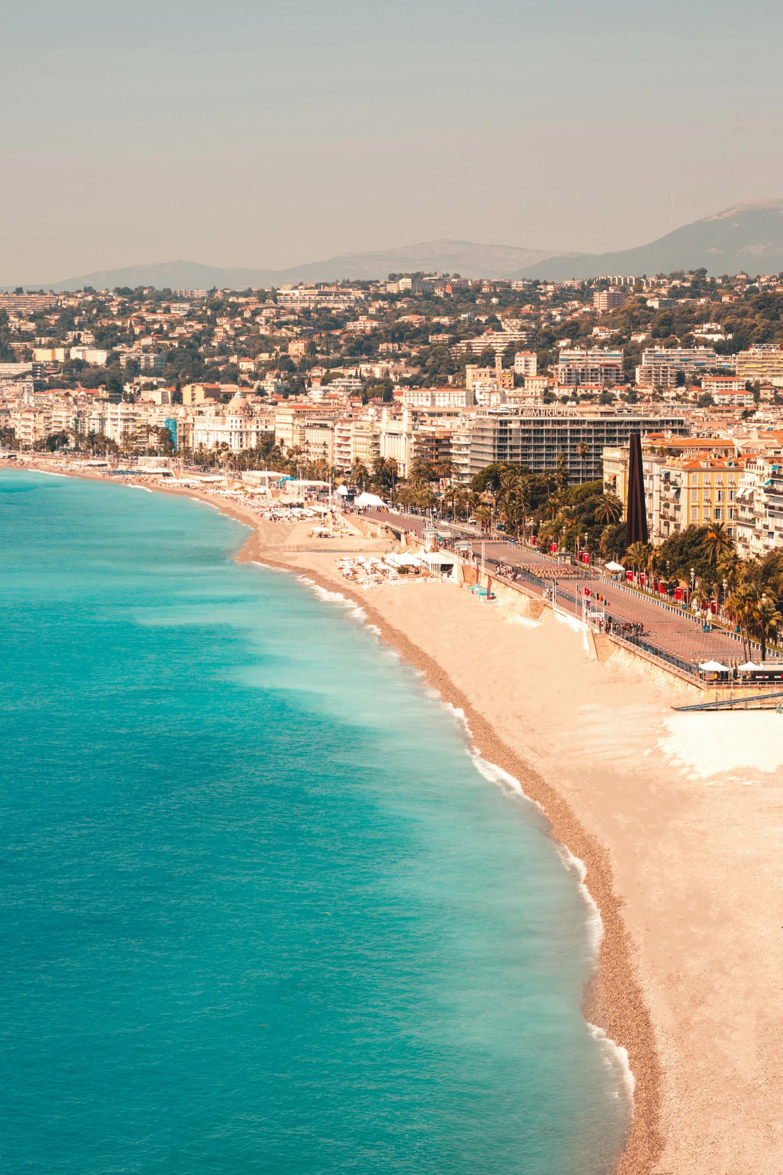 a large body of water next to a sandy beach, renaissance, nice, surrounding the city, flatlay, slide show