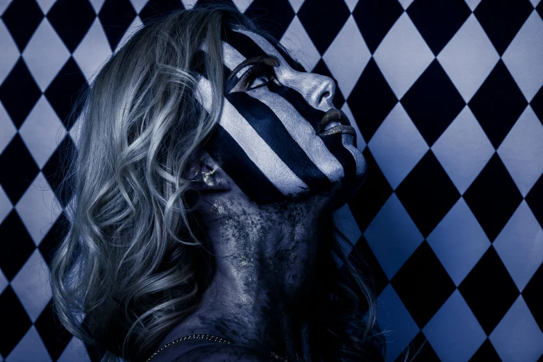 a woman with a black and white face paint, inspired by Károly Lotz, unsplash, transgressive art, blue checkerboard dress, close up of a blonde woman, club photography, stripes