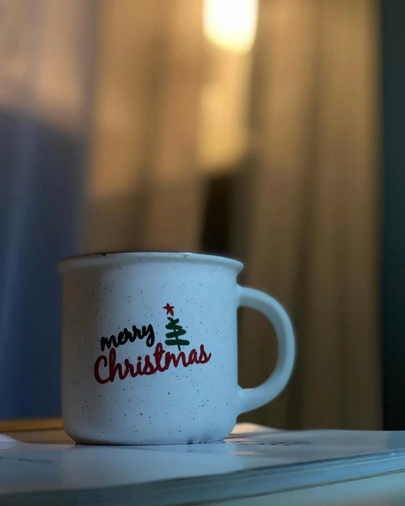 a mug with an ugly santa's help logo