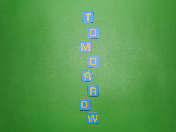 the word tomorrow spelled in blue letters on a green background, an album cover, trending on pixabay, temporary art, tabletop game board, topdown, blocks, blue wall