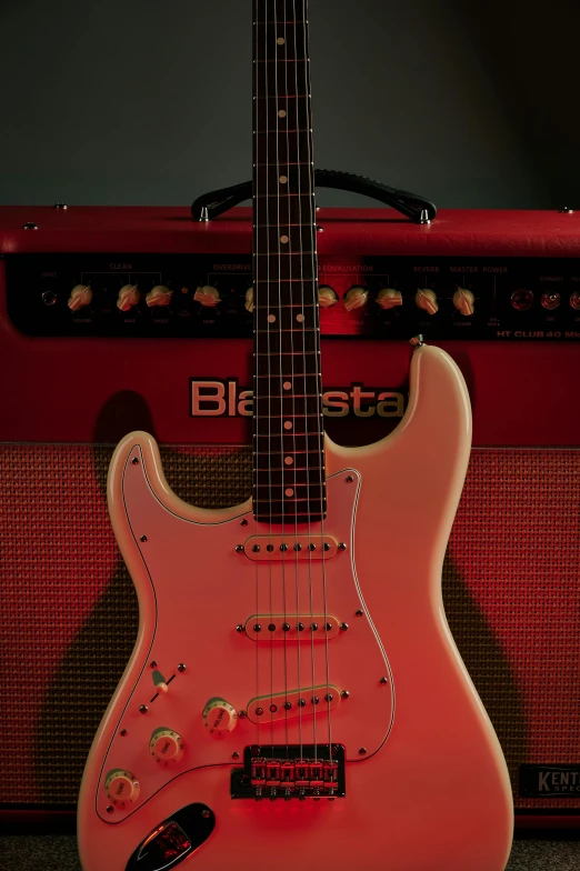 a pink electric guitar sitting next to a red amp, by Tom Bonson, shutterstock contest winner, photorealism, blues, red leds, cream, game ready