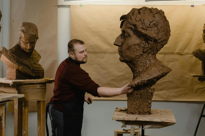 a man is working on a sculpture in a studio, by David Donaldson, academic art, bust with face of emma watson, yulia nevskaya, portait image, thumbnail