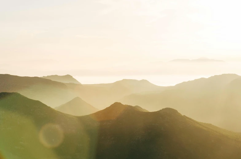 the view from a high point of view with mountains in the background