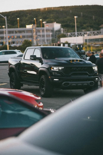 black ram parked in front of other vehicles