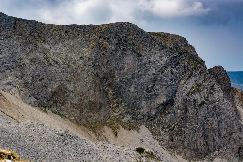 the top of a hill with rock on it