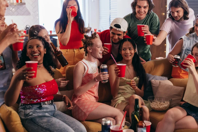 a group of people sitting on top of a couch, trending on pexels, renaissance, awkwardly holding red solo cup, college girls, profile image, fourth of july