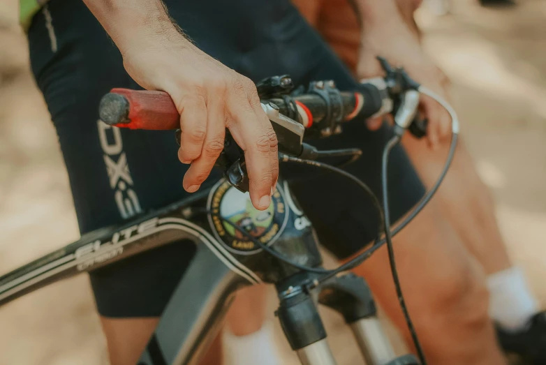 a close up of a person riding a bike, riding a bike, levers, profile image, detailing