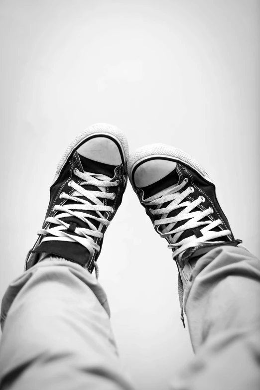 a black and white photo of a pair of sneakers, by Altichiero, posing!!, emo style, happy toes, high