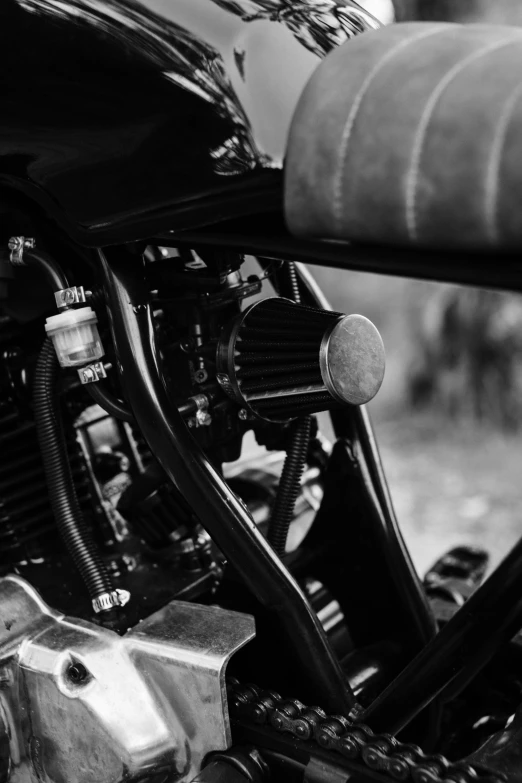 a black and white photo of a motorcycle, unsplash, closeup of car engine, medium format, uploaded, pipes