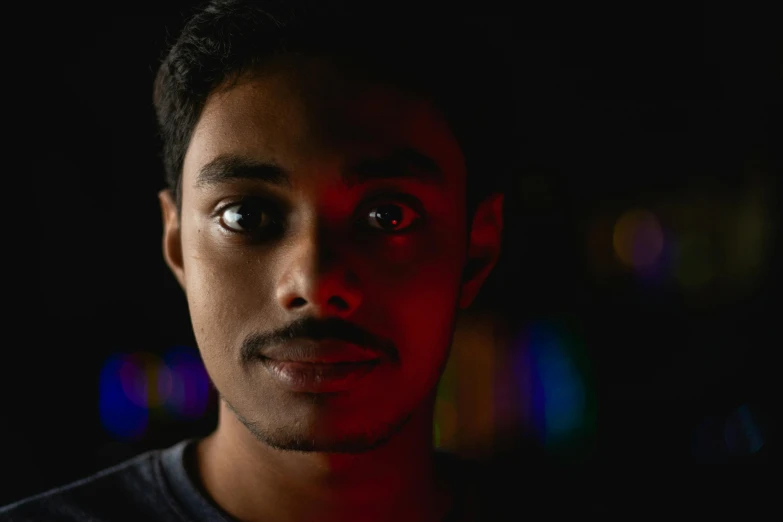 a close up of a person in a dark room, a character portrait, jayison devadas, bokeh in the background only, red - eyed, multiple stories
