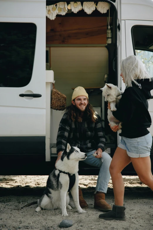 two women and a dog in front of a van, trending on unsplash, white male, white hair dreads, husky, thumbnail