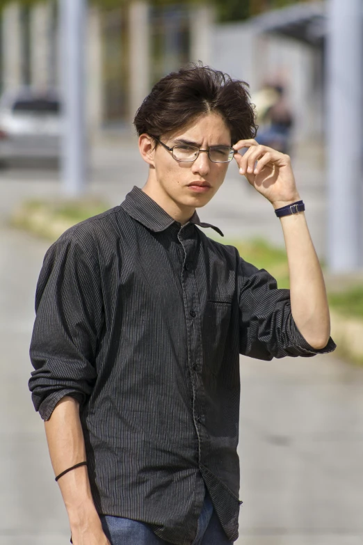 a young man riding a skateboard down a street, inspired by Jean Malouel, trending on pexels, hyperrealism, with square glasses, portrait androgynous girl, shabab alizadeh, black shirt