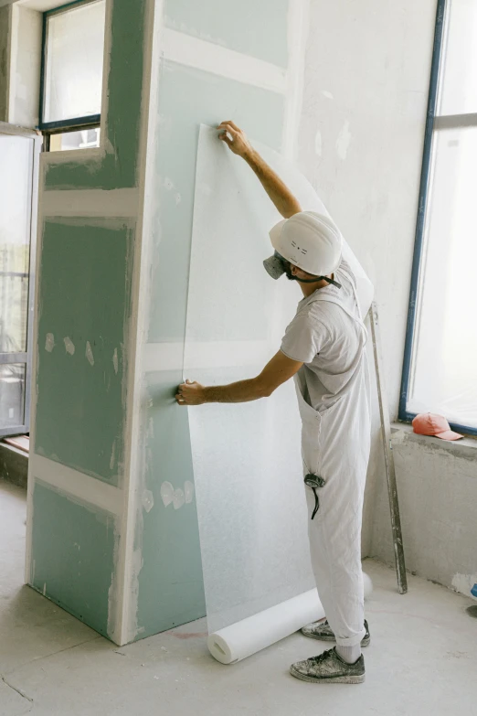 a man is painting a wall in a room, tall thin build, thumbnail, marble material, white