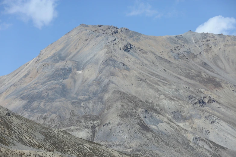 a view of some very rocky mountains in the daytime