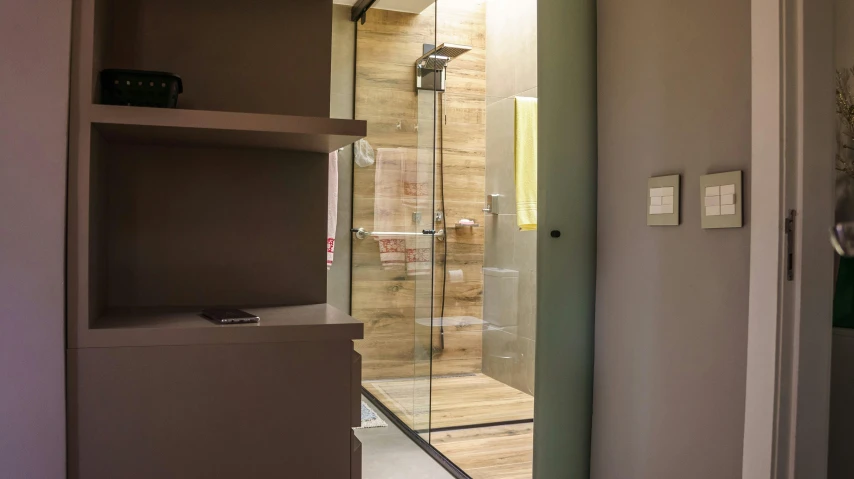 a bathroom showing a toilet, bathtub and a television on top of the stand