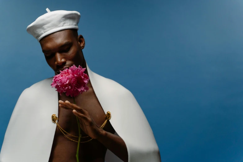 a man with a flower in his hand