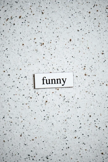 a piece of paper with the word funny on it, by Thomas Fogarty, trending on unsplash, white ceramic shapes, recessed, enamel, spotted