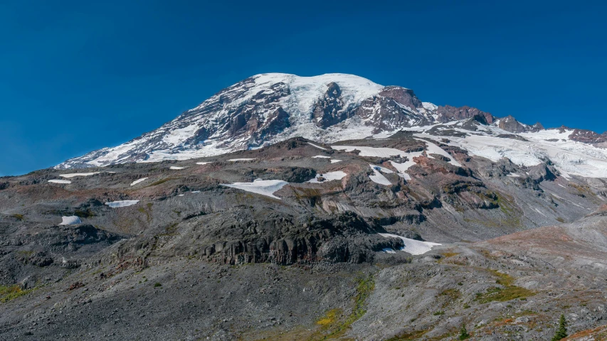 a mountain with some very high snow on top