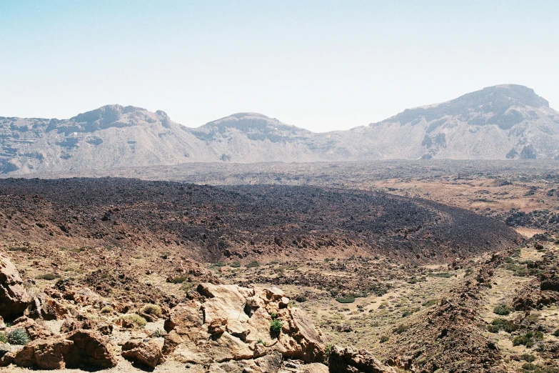 view of rocky desert with sp terrain and mountains in the background