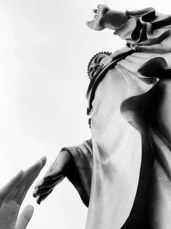 a black and white photo of a statue, by Patrick Pietropoli, she is approaching heaven, 1 9 8 5 photograph, low detail, david la chapelle
