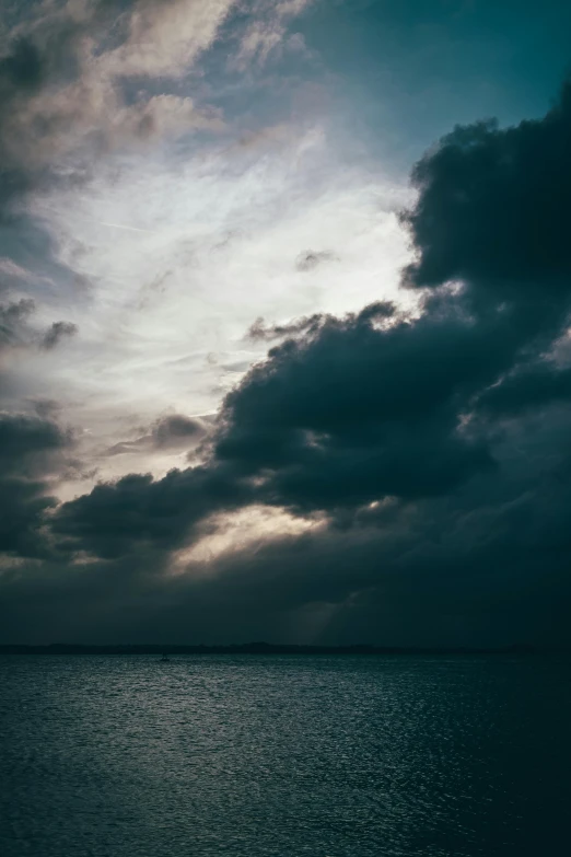 the view from an airplane looking at the dark clouds