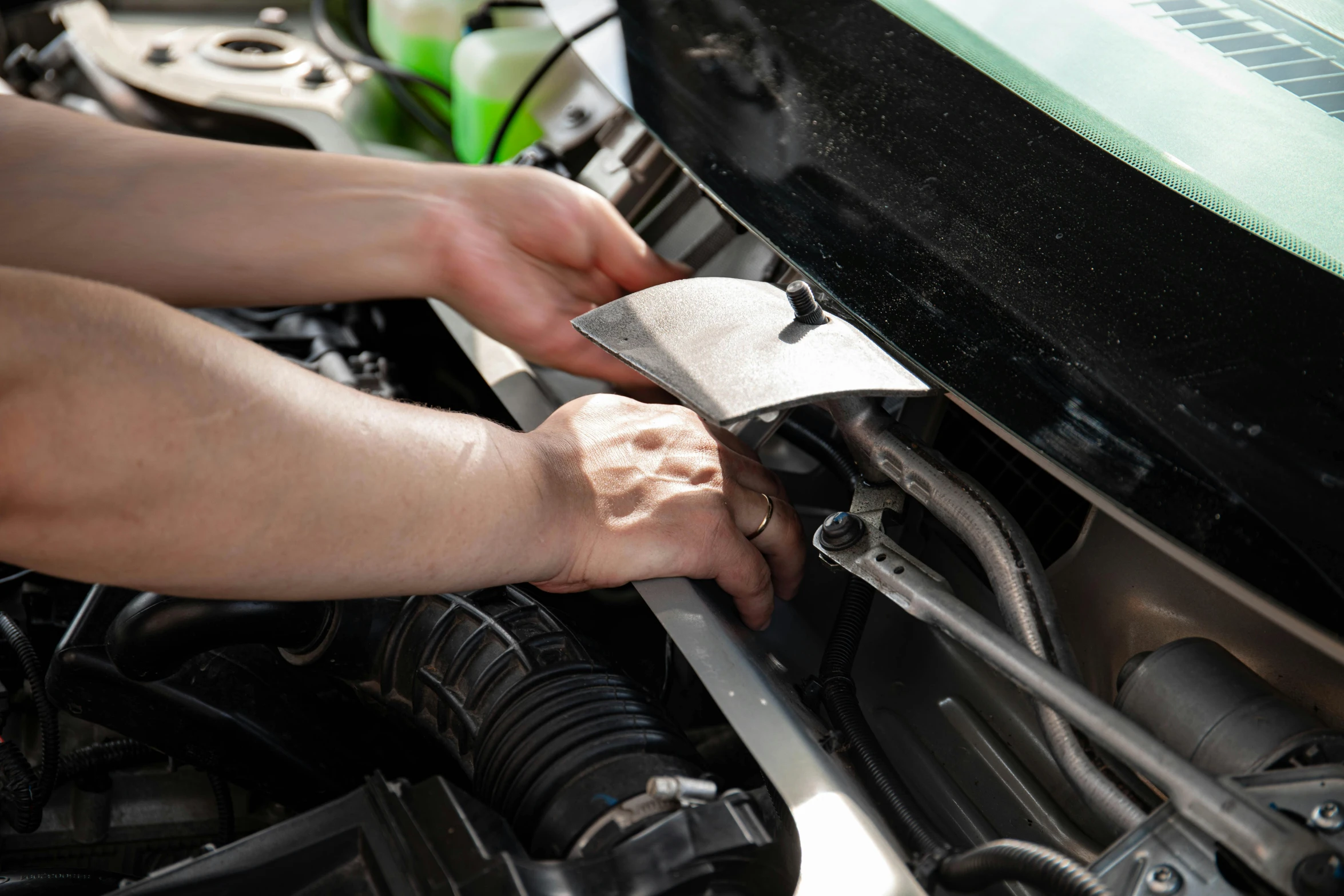 a close up of a person working on a car engine, rectangle, profile image, fan favorite, digital image