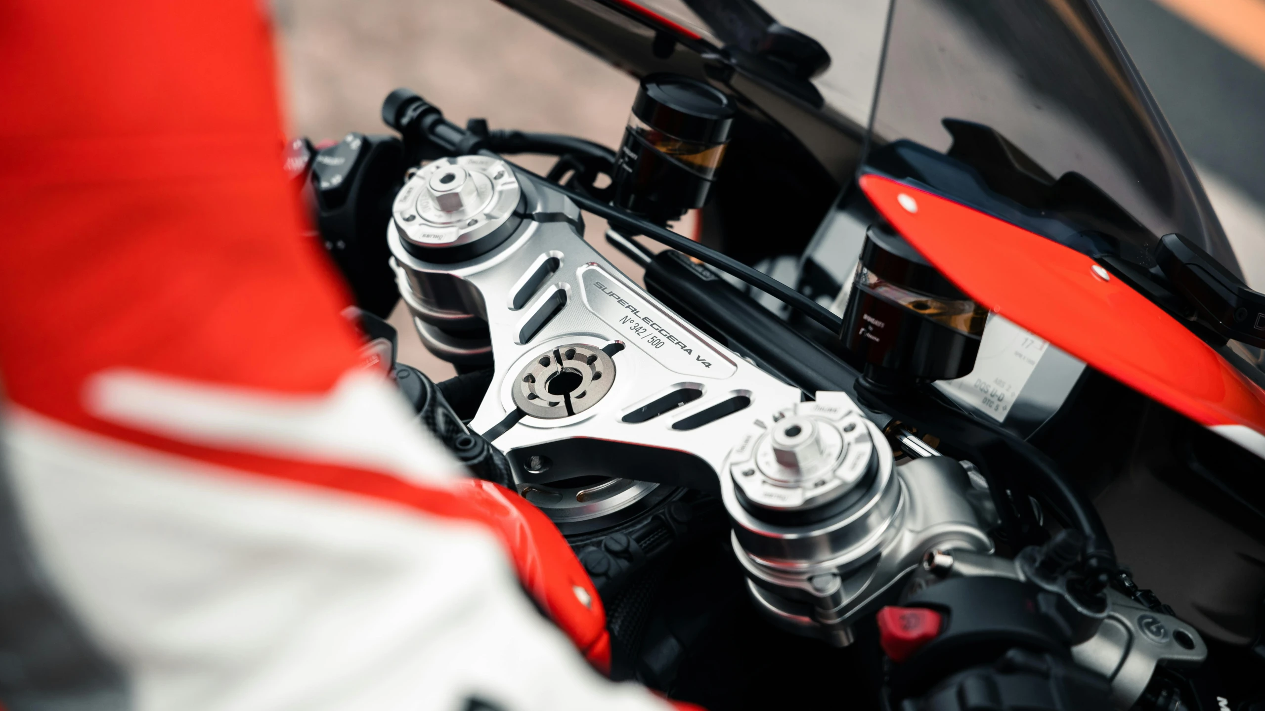 a close up of the engine of a motorcycle, inspired by Brian Dunlop, unsplash, silver white red details, fanatec peripherals, closeup of arms, formulae