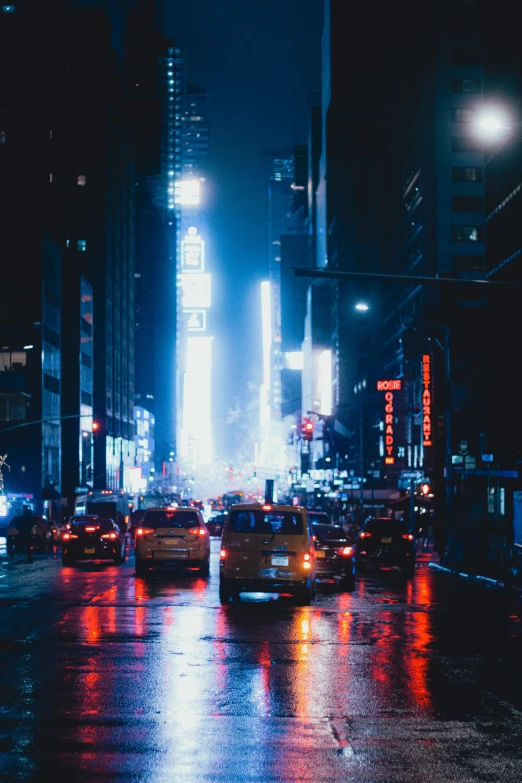 a city street filled with lots of traffic at night, unsplash contest winner, visual art, sci - fi scene future new york, wet street, beautiful blue lights, telephoto shot