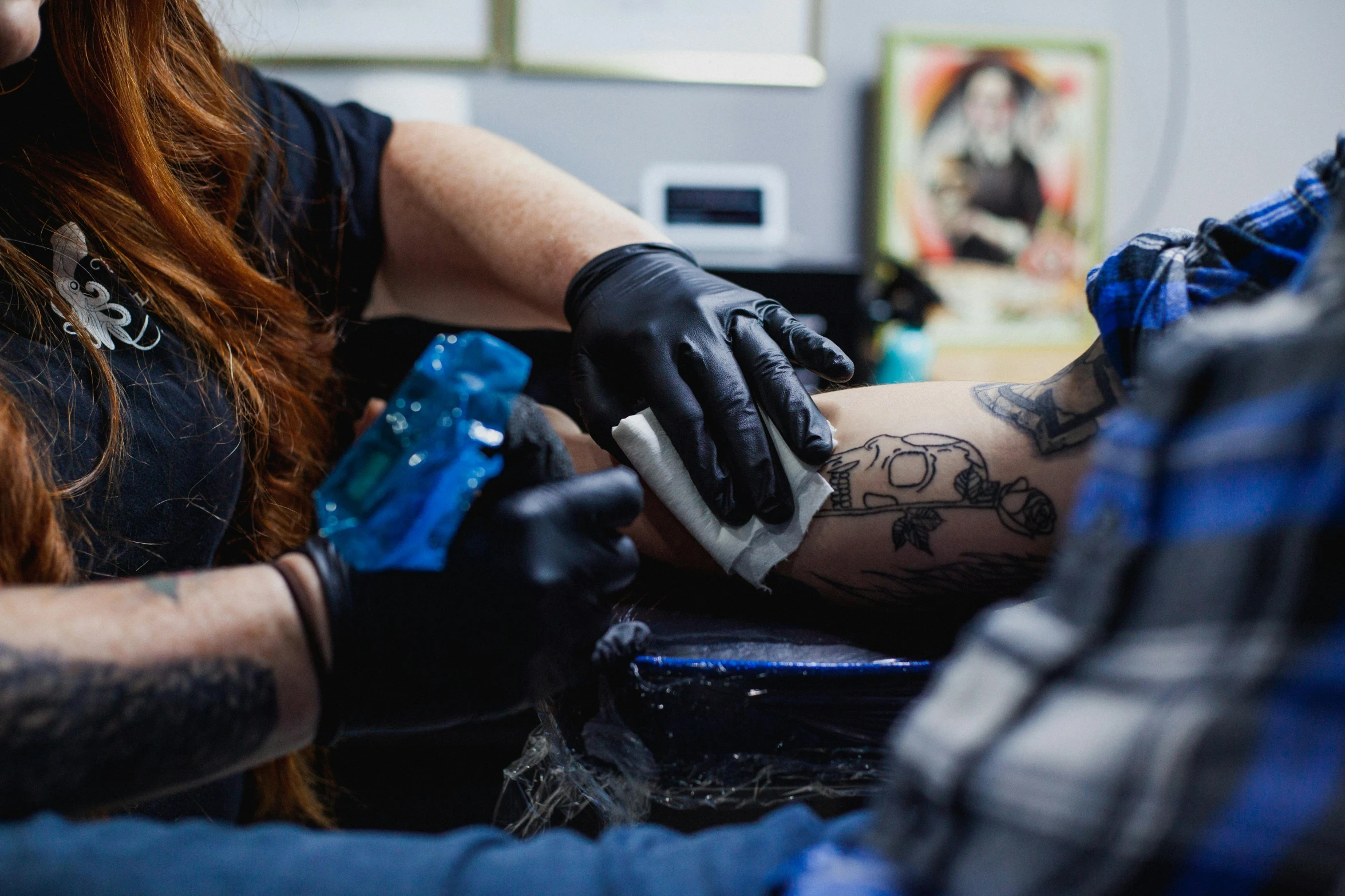 a woman getting a tattoo on a man's arm, a tattoo, by Meredith Dillman, pexels contest winner, blue veins, thumbnail, iconic scene, te pae