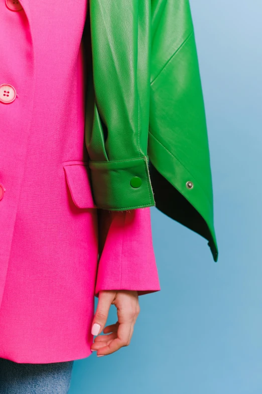 a woman in a pink jacket and green jacket, highly detailded, colour blocking, detail shot, bright sky