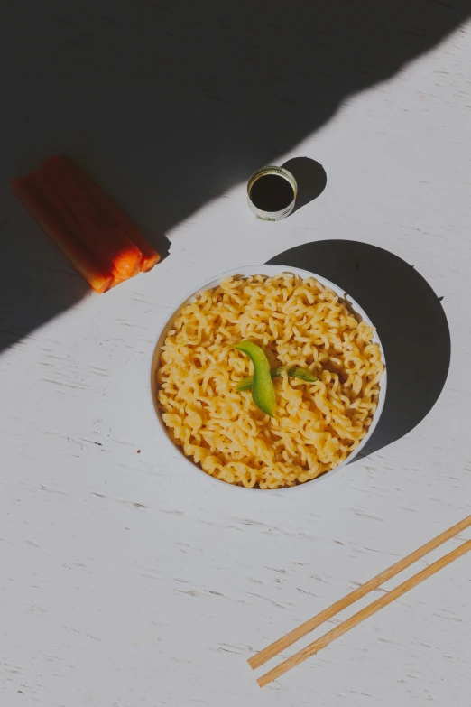 a bowl of rice and chopsticks on a table, unsplash, photorealism, body made out of macaroni, orange neon, detailed product image, light tan