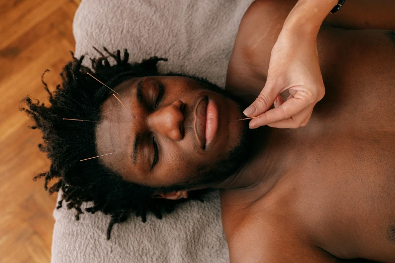 a man getting a back massage from his master