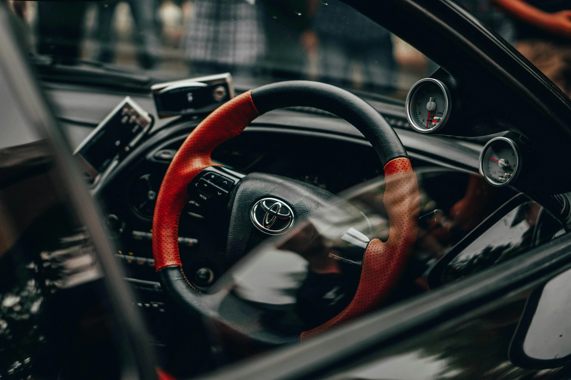 a view from the inside of a vehicle looking at the steering wheel