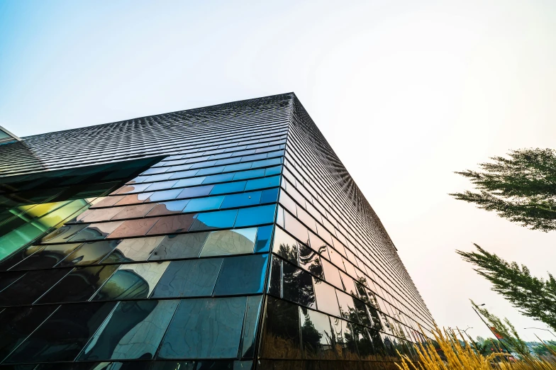 a close up of a building with a sky background, inspired by Tadao Ando, unsplash, hangzhou, colorful glass wall, looking partly to the left, over-shoulder shot