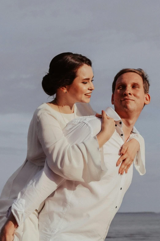 a man carrying a woman on his back on the beach, unsplash, renaissance, wearing a linen shirt, bouguereau style pose, still frame from a movie, wedding