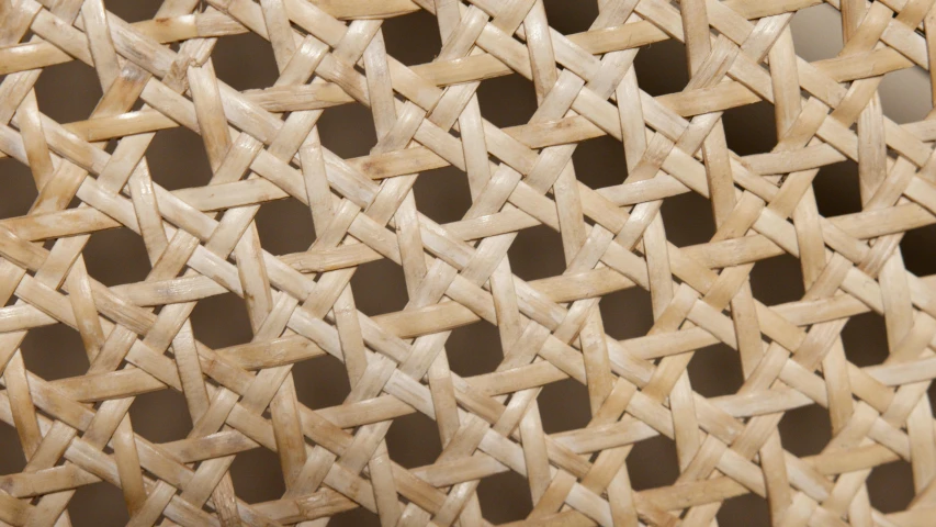 a close up of a wicker chair with holes in it, a macro photograph, inspired by Anni Albers, trending on pexels, op art, beige, natural materials, translucent material, detailed product image