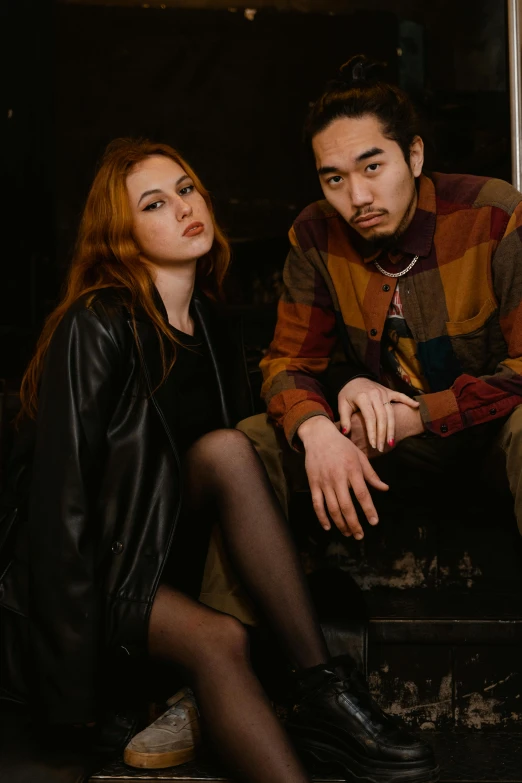 a man and a woman sitting next to each other, inspired by Nan Goldin, unsplash, renaissance, she looks like a mix of grimes, confident pose, official store photo, black and brown