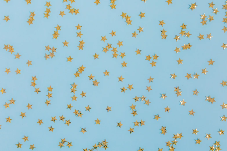 a bunch of gold stars on a blue background, trending on unsplash, background image, enamel, set photo