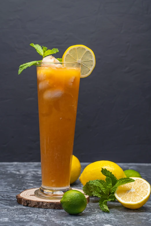 a tall glass of iced tea with lemons and mint, by Austin English, on a gray background, scimitar, mango, slush